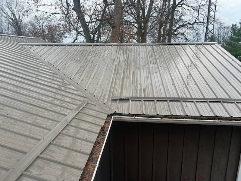 Residential metal roof after soft washing with oxidation and debris removed